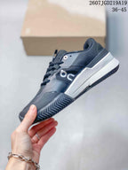 Side view of the black and white low-top tennis shoe showing the layered upper, On branding, contrasting midsole, and patterned outsole; style code 2607TGD219A19 and size range 36-45 are visible.