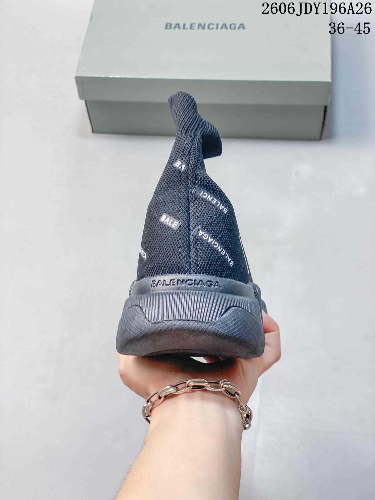 Rear view of a dark gray Balenciaga sock sneaker showing the raised heel and stretch-knit upper.