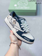 Black and white low-top Jordan sneaker with Labubu graphics, white laces and a black outsole.