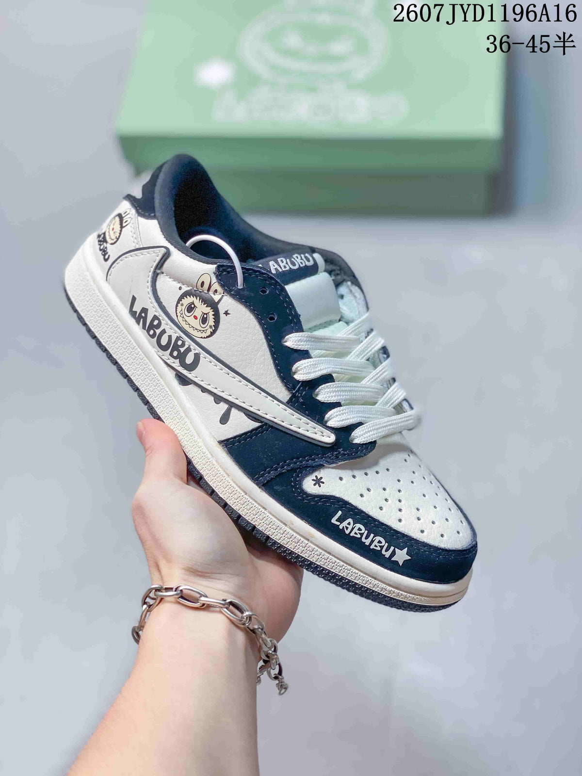 Black and white low-top Jordan sneaker with Labubu graphics, white laces and a black outsole.