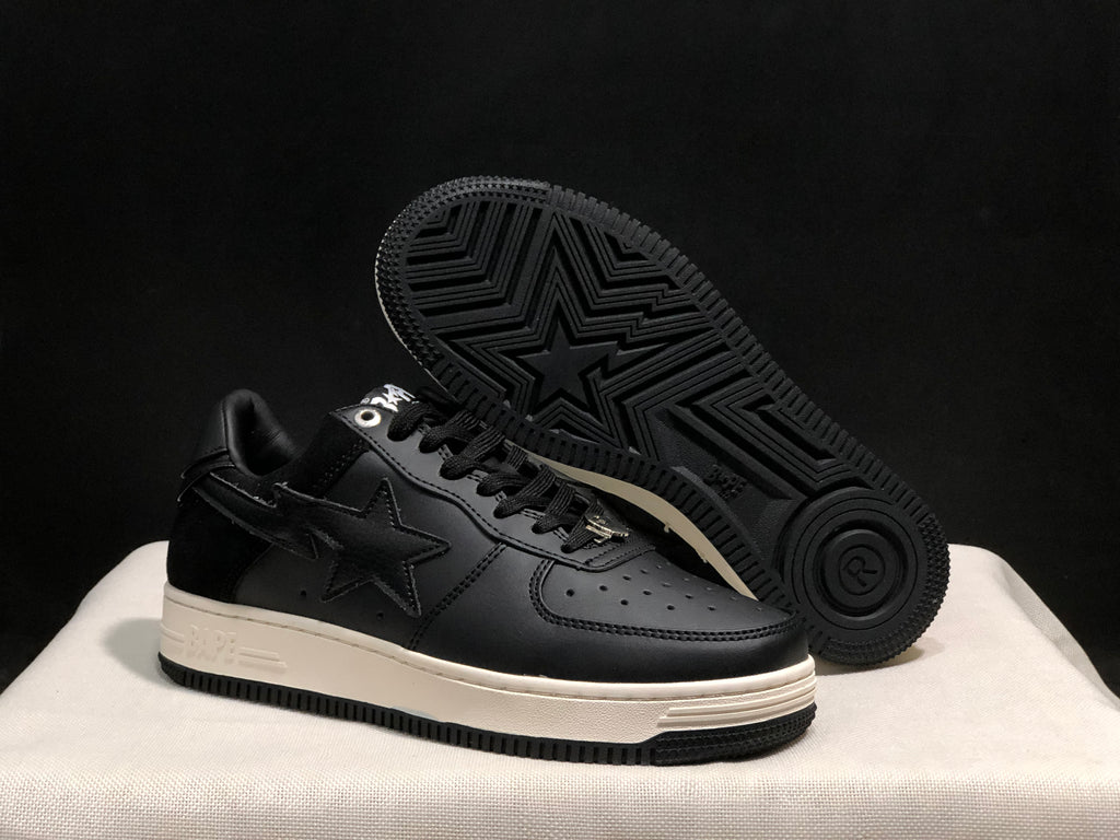 Angled view showing the outsole pattern, star detail, white midsole, and black upper.