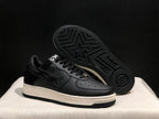 Angled view showing the outsole pattern, star detail, white midsole, and black upper.
