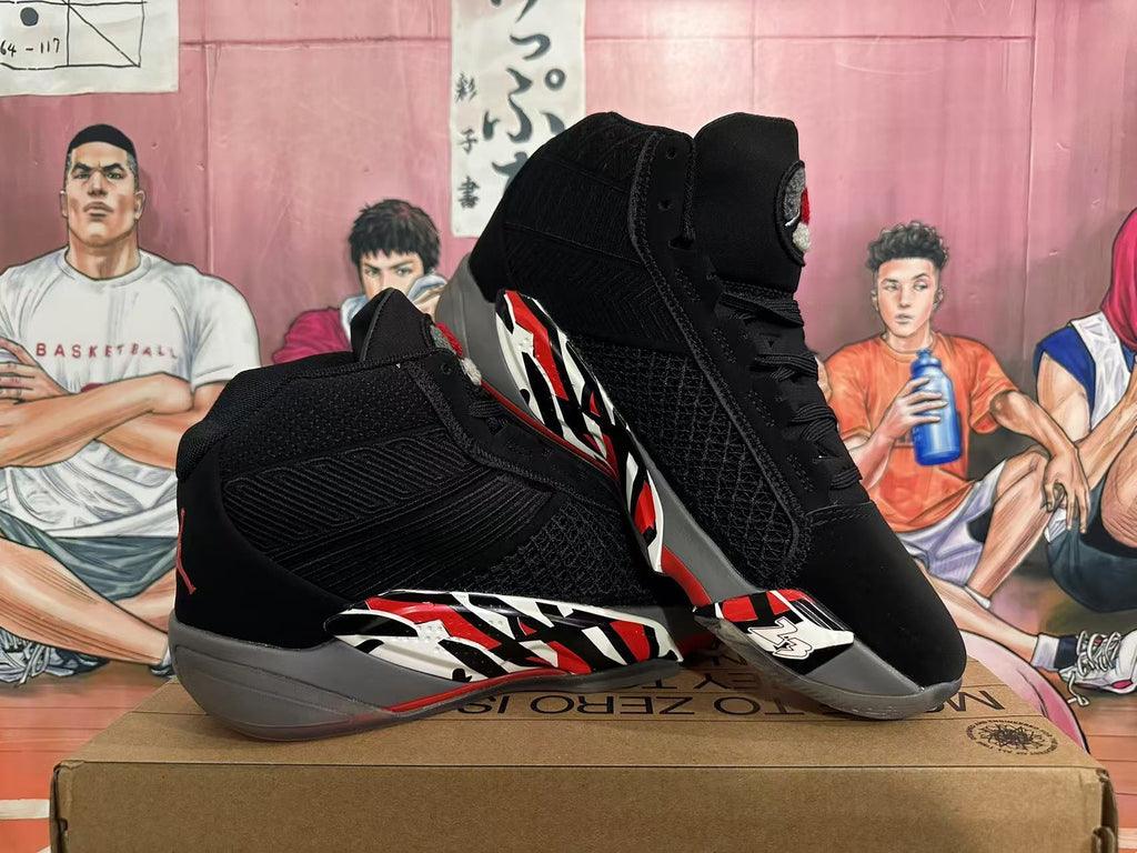 Pair of black Jordan 23 high-top sneakers showing the graphic side panels and gray soles.