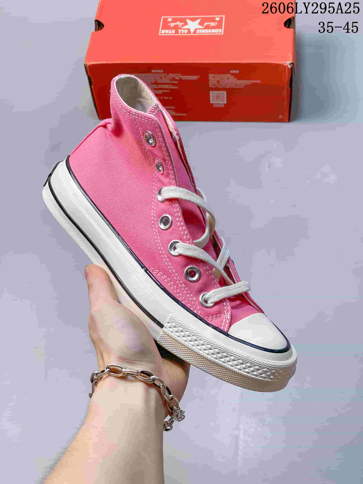 Pink high-top lace-up sneaker with white toe cap and sole