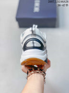Rear view of the sneaker showing the padded heel, layered sole, and gum-colored outsole edge.