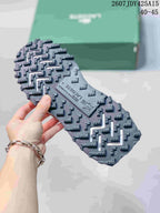 Close-up of the sneaker outsole showing a dark lugged tread pattern and Lacoste branding.