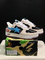Pair of BAPE Bape Sta low-top sneakers displayed on a camouflage BAPE shoebox, showing cream, black, blue, and burgundy details; the box label shows US 7, UK 6, EU 40, and CM 25.