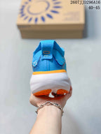 Rear view of a blue ASICS GEL-Nimbus 25 running shoe showing the heel pull tab, padded collar, white midsole, and orange outsole.