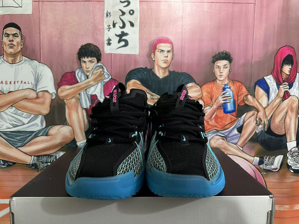Front view of black Nike GT Cut 3 basketball shoes with turquoise and blue accents