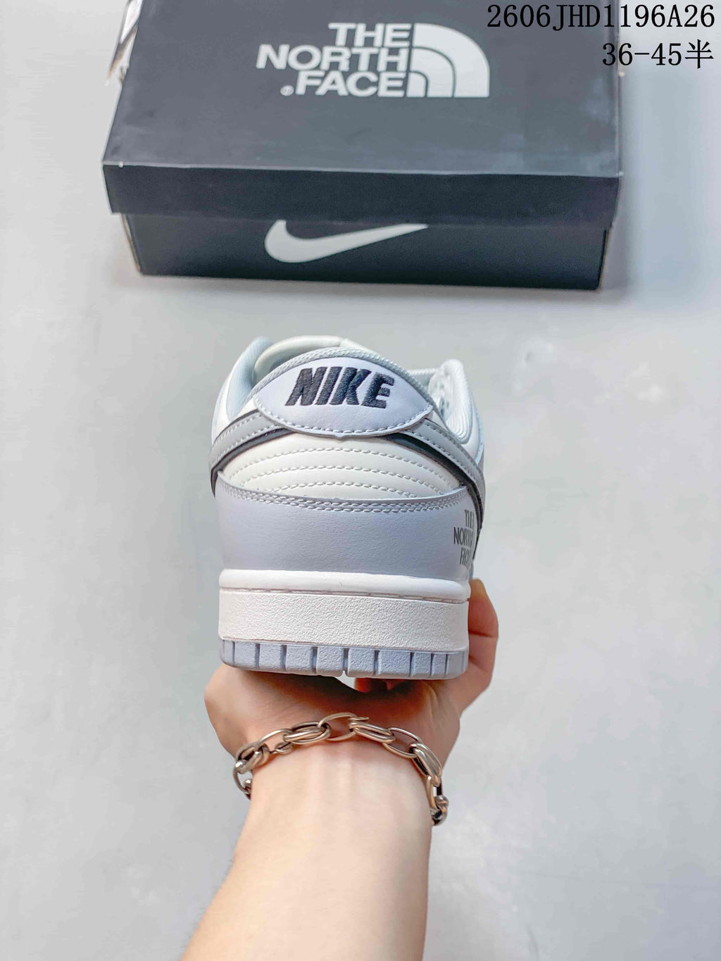 Rear view of the sneaker showing heel branding and a layered white sole.