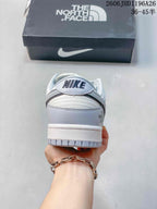 Rear view of the sneaker showing heel branding and a layered white sole.