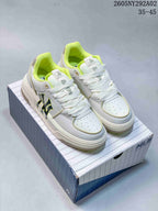 Pair of white MLB Chunky Liner sneakers with bright yellow-green accents