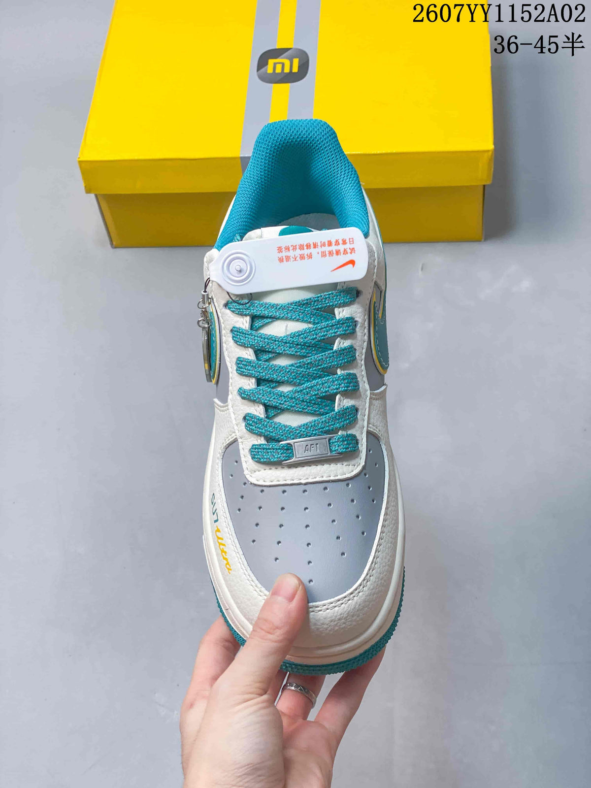 Top view showing perforated toe panel and turquoise laces