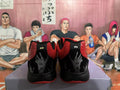 Rear view of red and black Nike basketball shoes with embroidered heel details