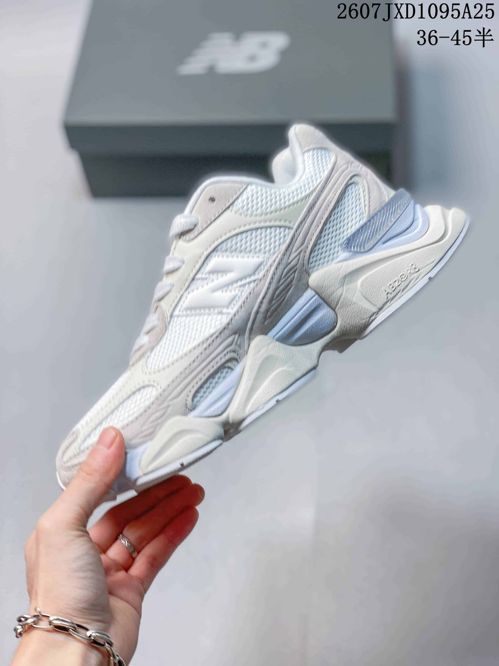 Side profile highlighting the layered upper, mesh panels, and chunky sculpted sole.