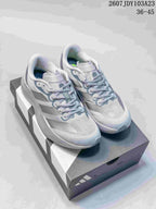 Pair of light gray and white adidas Adizero Evo SL M running shoes displayed on a shoebox, with the listed size range visible at the top.