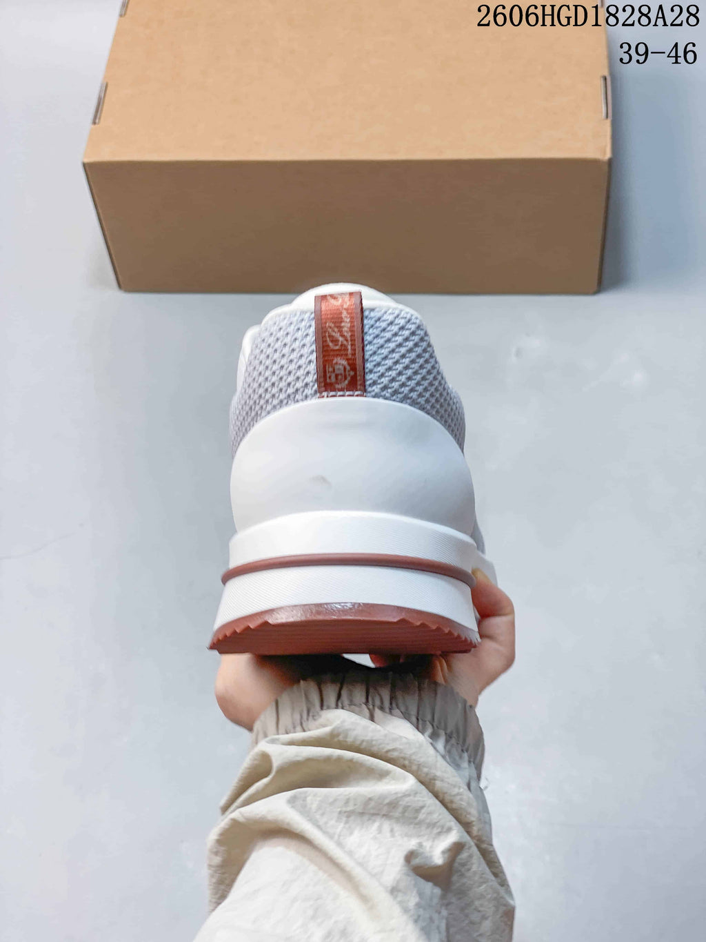 Rear view showing the padded heel and dusty-rose outsole trim.