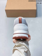 Rear view showing the padded heel and dusty-rose outsole trim.