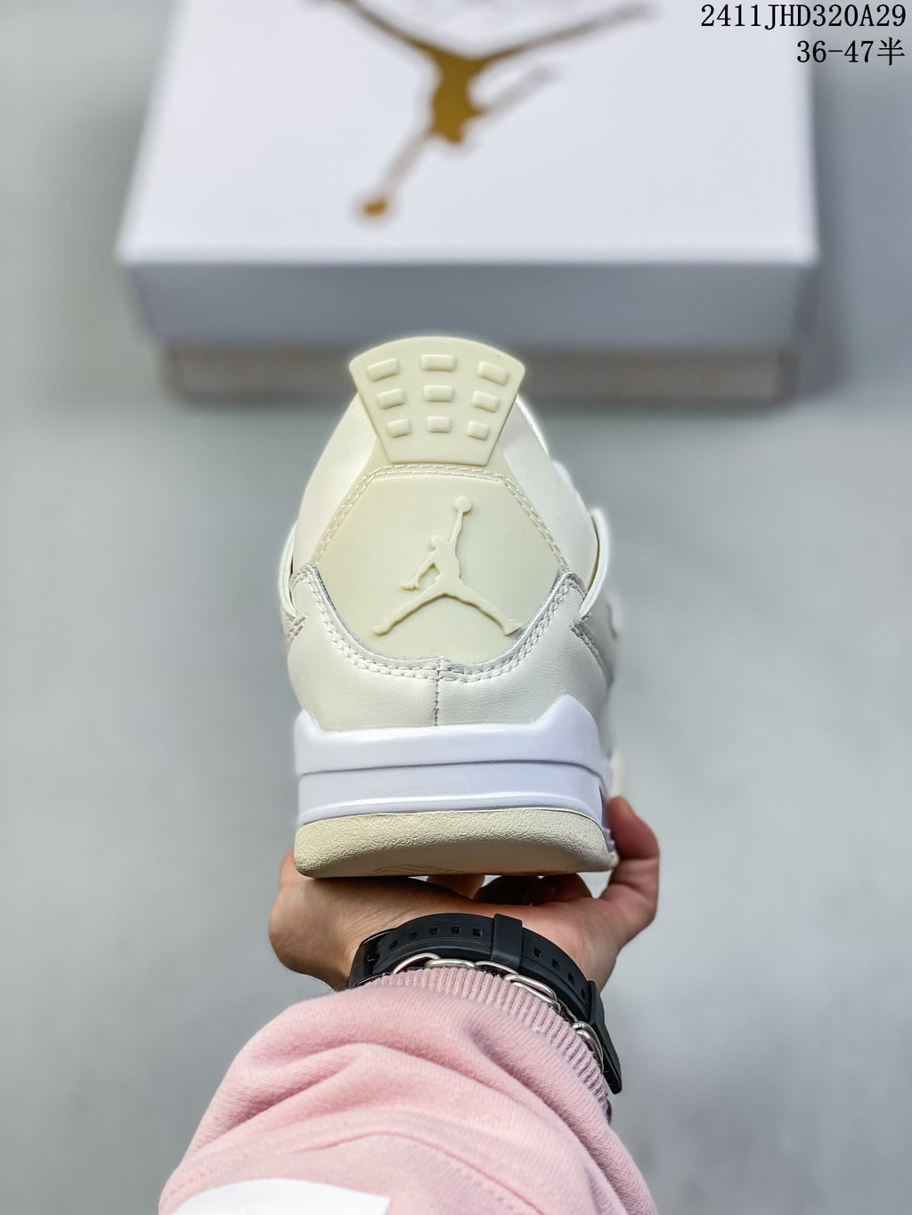 Rear view of a white high-top sneaker showing the heel logo, padded collar, and layered midsole.