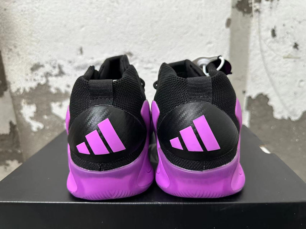 Rear view of purple and black high-top sneakers with contrasting heel panels