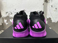 Rear view of purple and black high-top sneakers with contrasting heel panels