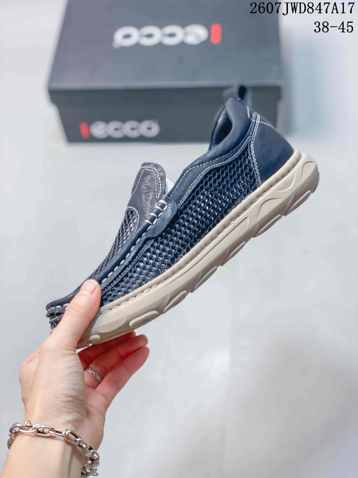 Side view of the navy ECCO slip-on shoe showing the mesh upper, low-profile shape, and light-colored outsole.