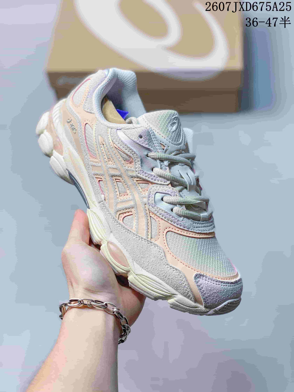 Angled side view of an ASICS GEL-NYC sneaker showing the layered upper and lace-up construction.