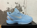 Side view of a light blue Nike basketball shoe with a textured upper, silver-tone Swoosh and sculpted sole.