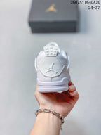Rear view showing the padded heel, Jumpman logo, and layered white midsole.