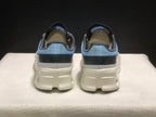 Rear view of the pair showing the padded collars, dark heel details, and white sculpted midsoles.