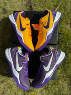 Purple and gold Kobe 8 shoes arranged together, showing both color panels.