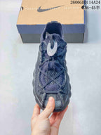 Front view showing the laces and dark gray upper