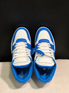Top view showing the white perforated toe boxes, blue overlays, tongues, and laces.