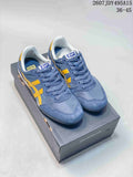 Pair of blue and yellow Onitsuka Tiger Serrano sneakers displayed on a branded shoebox; image text shows style code 2607 JDY495A15 and size range 36-45.