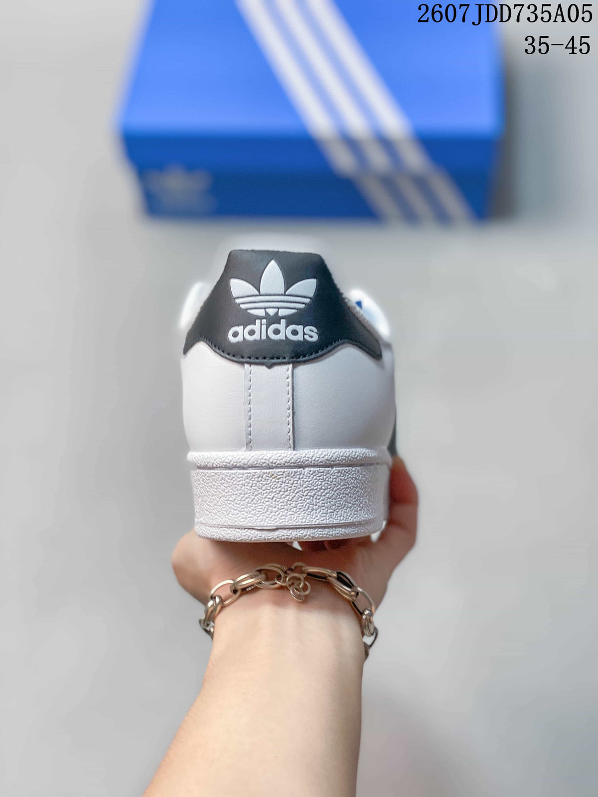 Rear view of the sneaker showing the black heel tab and Adidas trefoil branding.