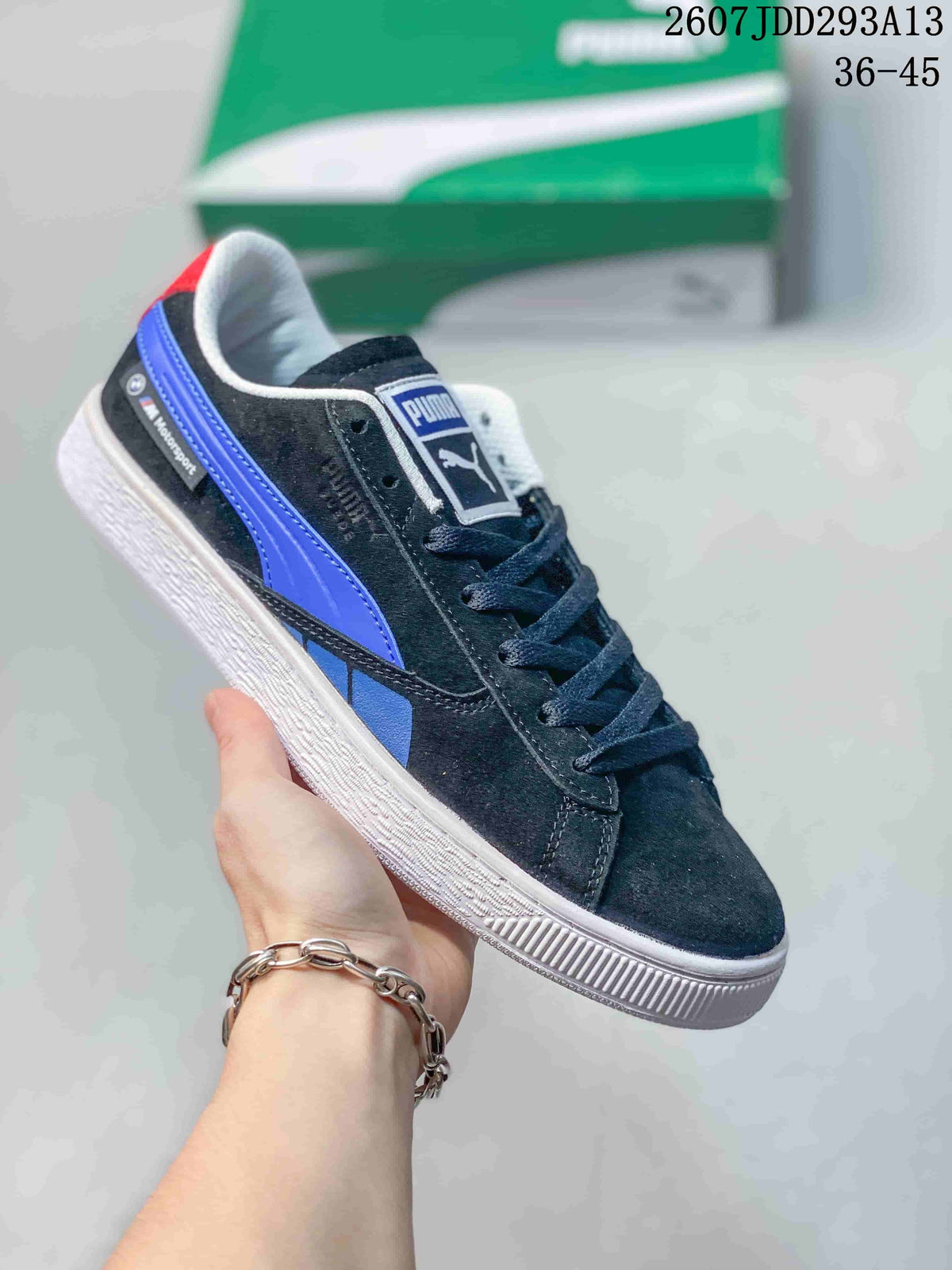 Black PUMA BMW M Motorsport sneaker with a blue side stripe, red heel accent and white outsole.