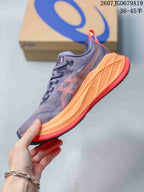 Side view highlighting the gray-purple upper, orange midsole, and coral outsole edge.