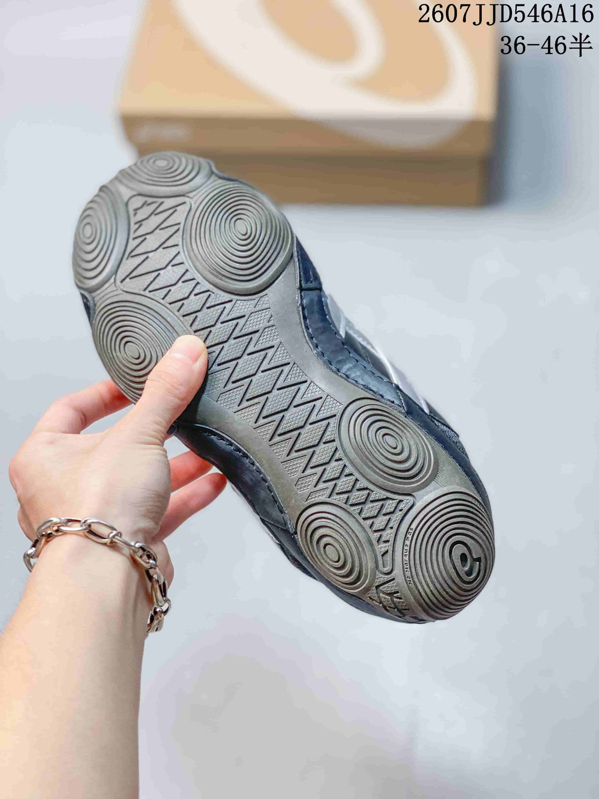 Underside view of an ASICS Hypersync sneaker showing the circular tread pattern and textured outsole.