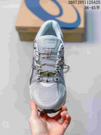 Top view of the sneaker showing the textured upper, layered lace system, and ASICS tongue branding; image text shows style code 1125A25 and size range 36–45.