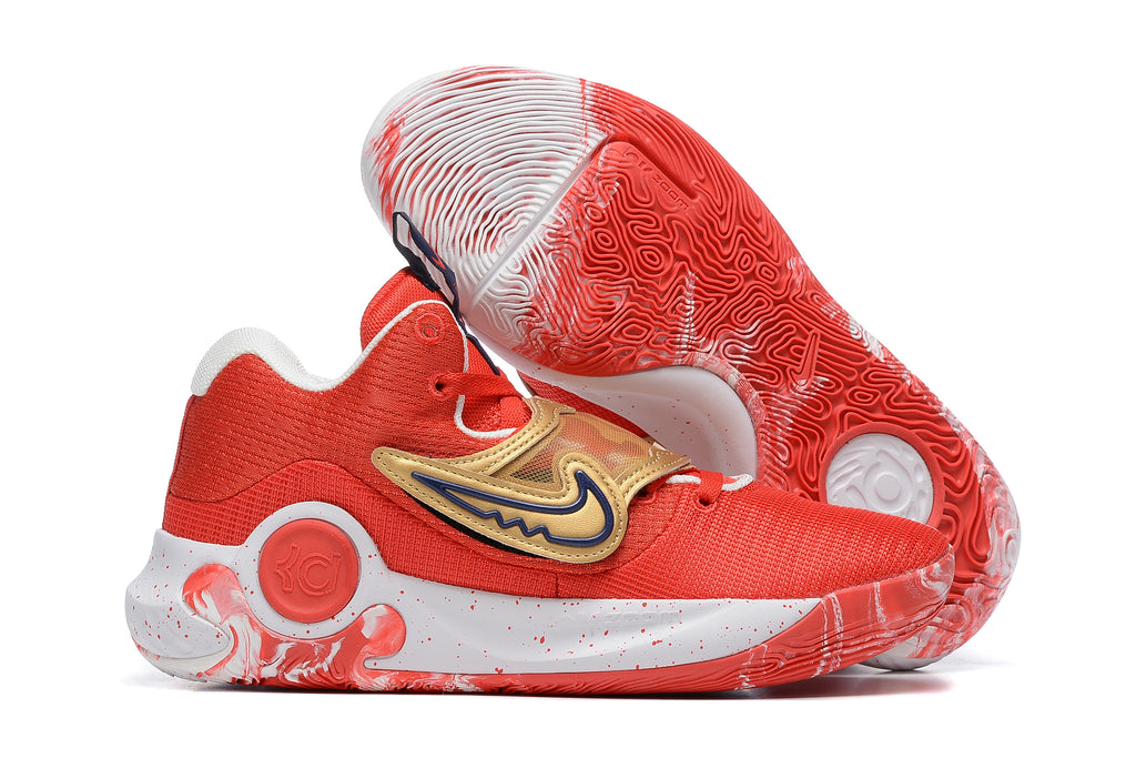 Red Nike KD basketball shoes with gold accents and a red-and-white patterned outsole.