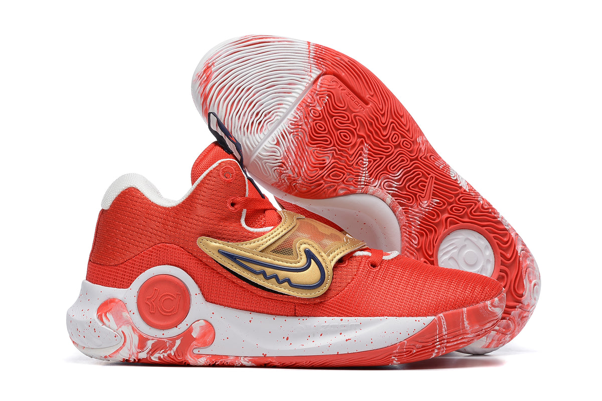 Red Nike KD basketball shoes with gold accents and a red-and-white patterned outsole.