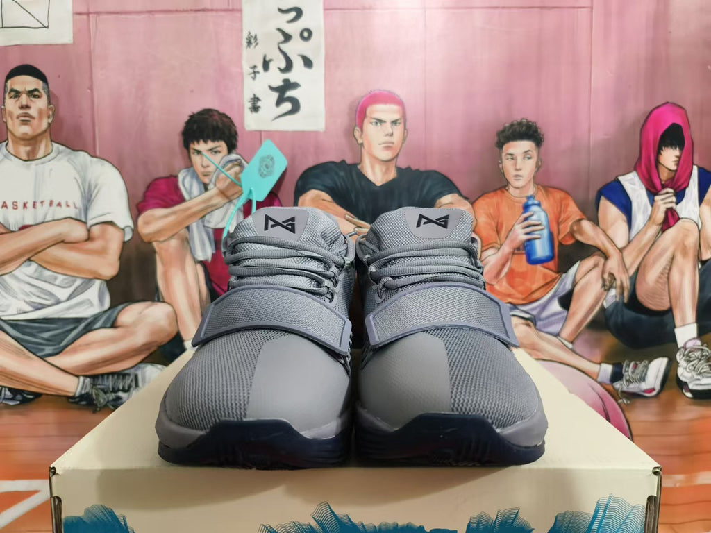 Front view of gray Nike basketball shoes with laces and wide forefoot straps