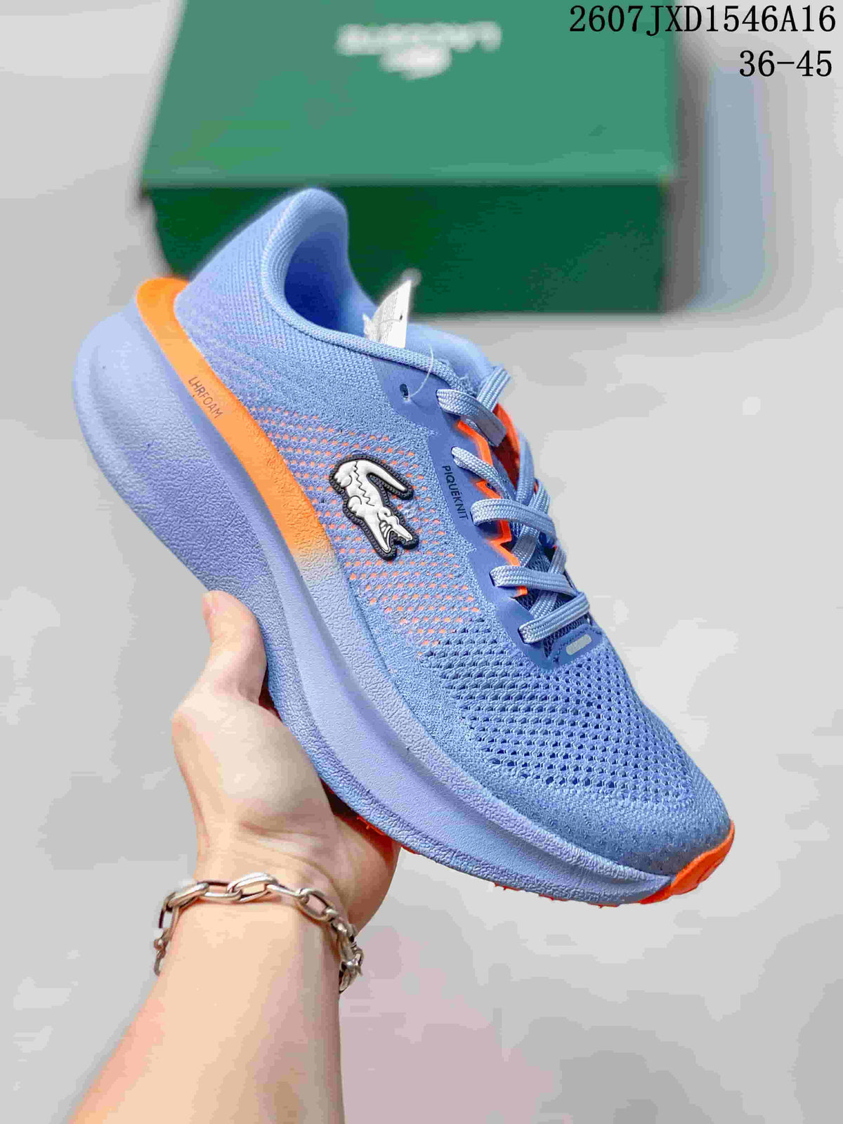 Blue Lacoste Neo Run low-top sneaker with orange accents, lace-up closure, crocodile side logo, and sculpted sole; size range text 36–45 is visible.