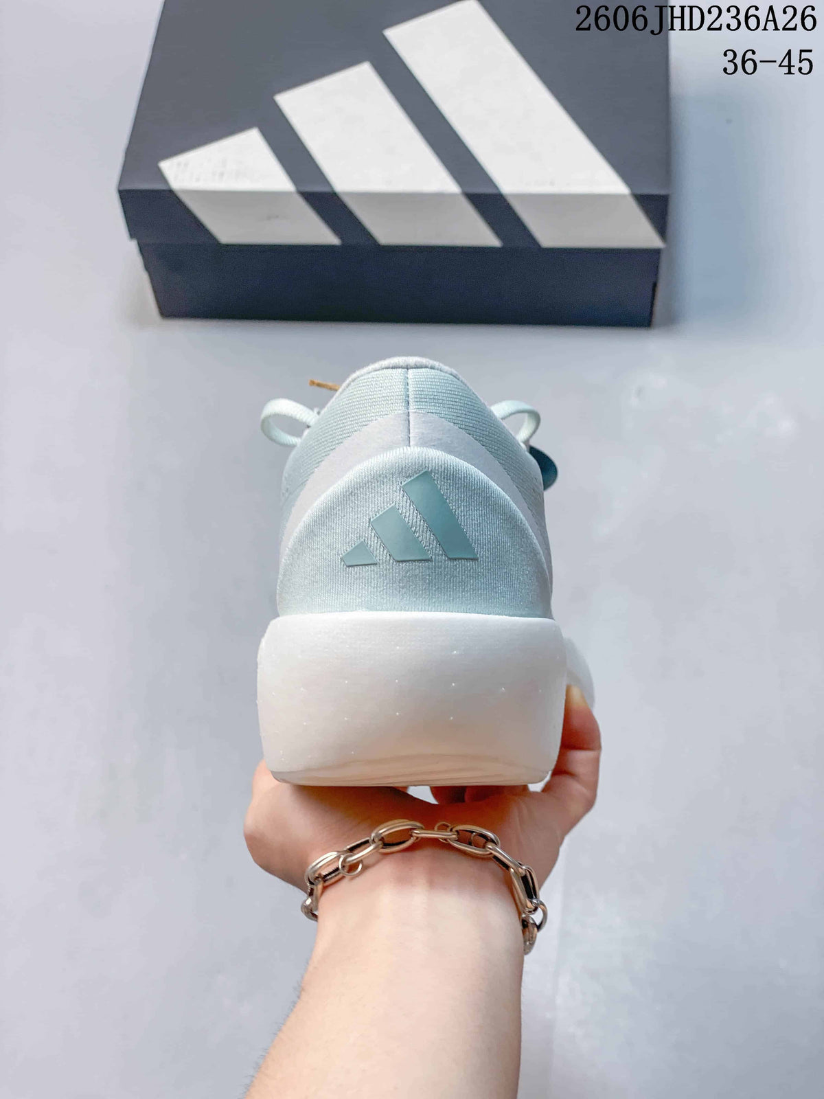 Rear view of the pale blue shoe showing the heel logo and thick white sole.