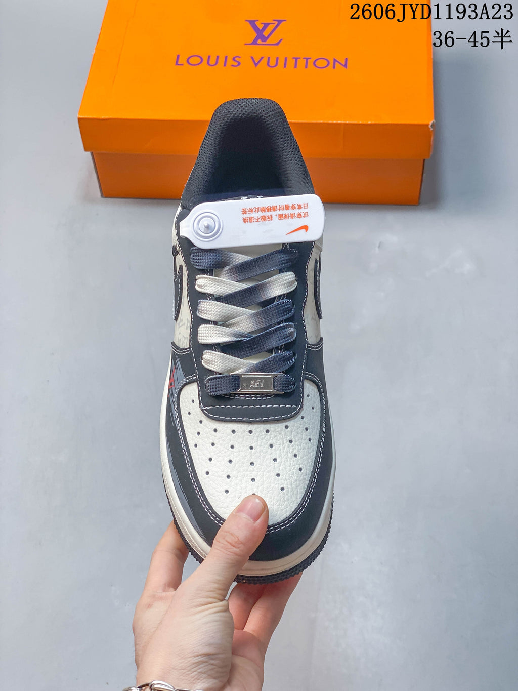 Top view of the perforated toe and contrasting cream and charcoal laces