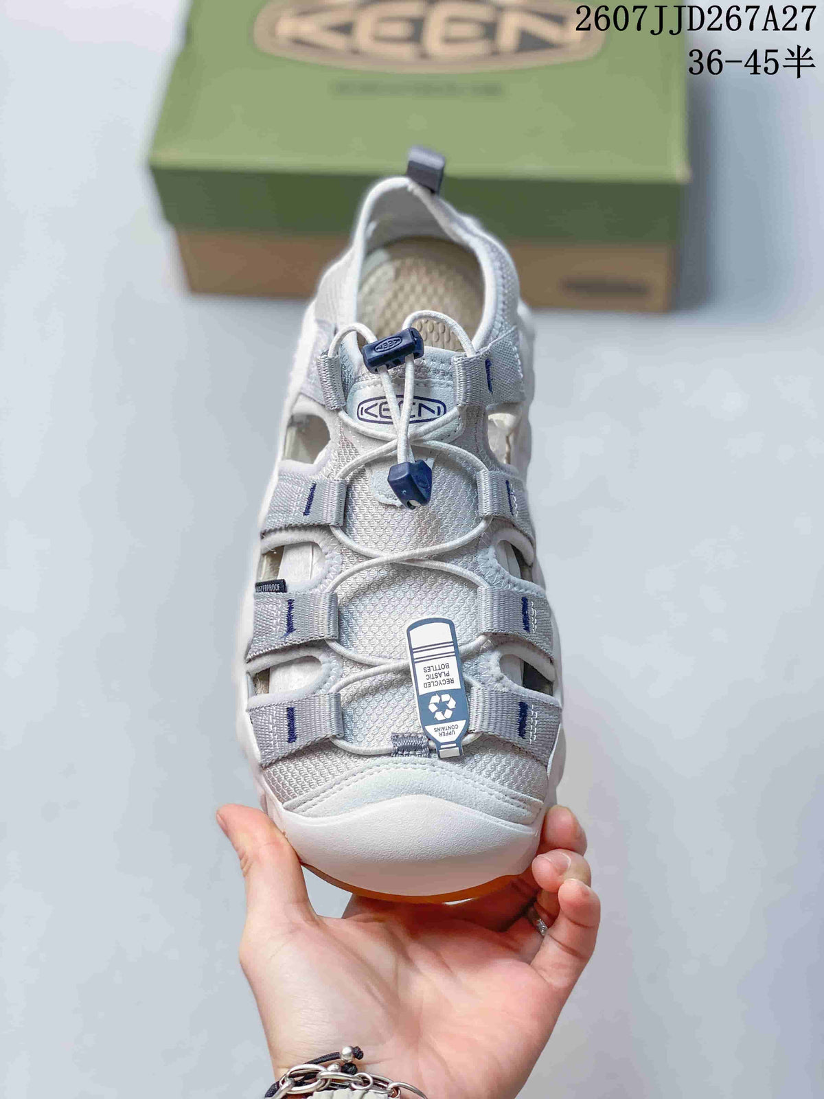 Top view of the KEEN sandal showing the closed toe, multiple upper openings, lace-and-toggle fastening, and attached product tag.