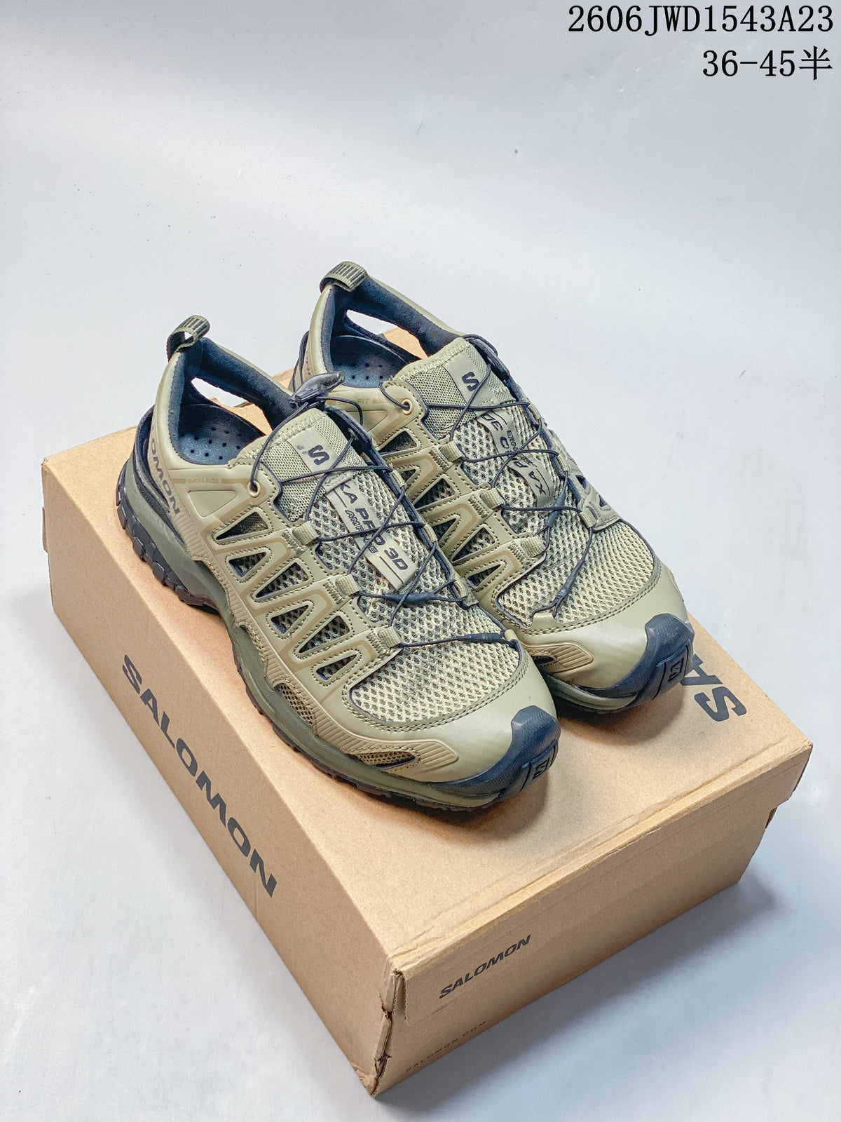 Olive-toned Salomon XA Pro 3D Amphib shoes shown on a branded box