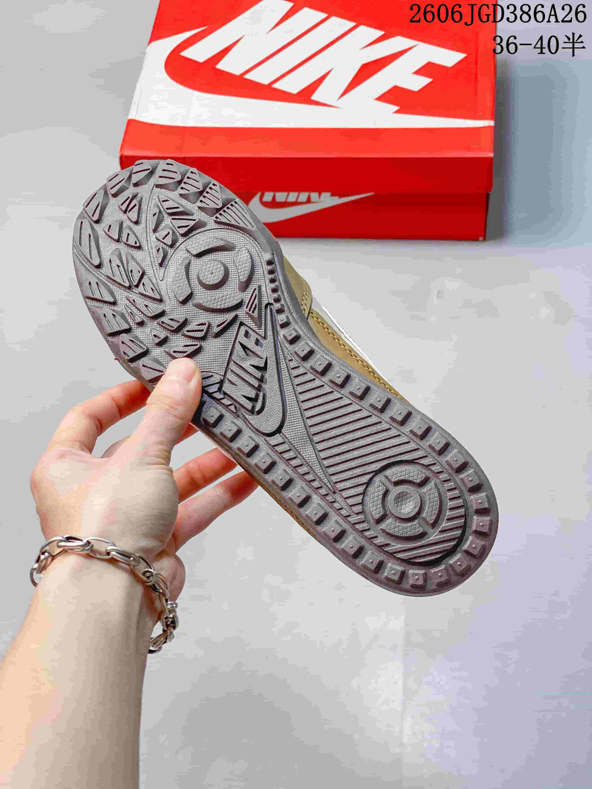Close view of the sneaker outsole showing raised lug-like tread and circular traction patterns.