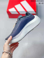 Side profile highlighting the textured navy side panel and layered white midsole area.