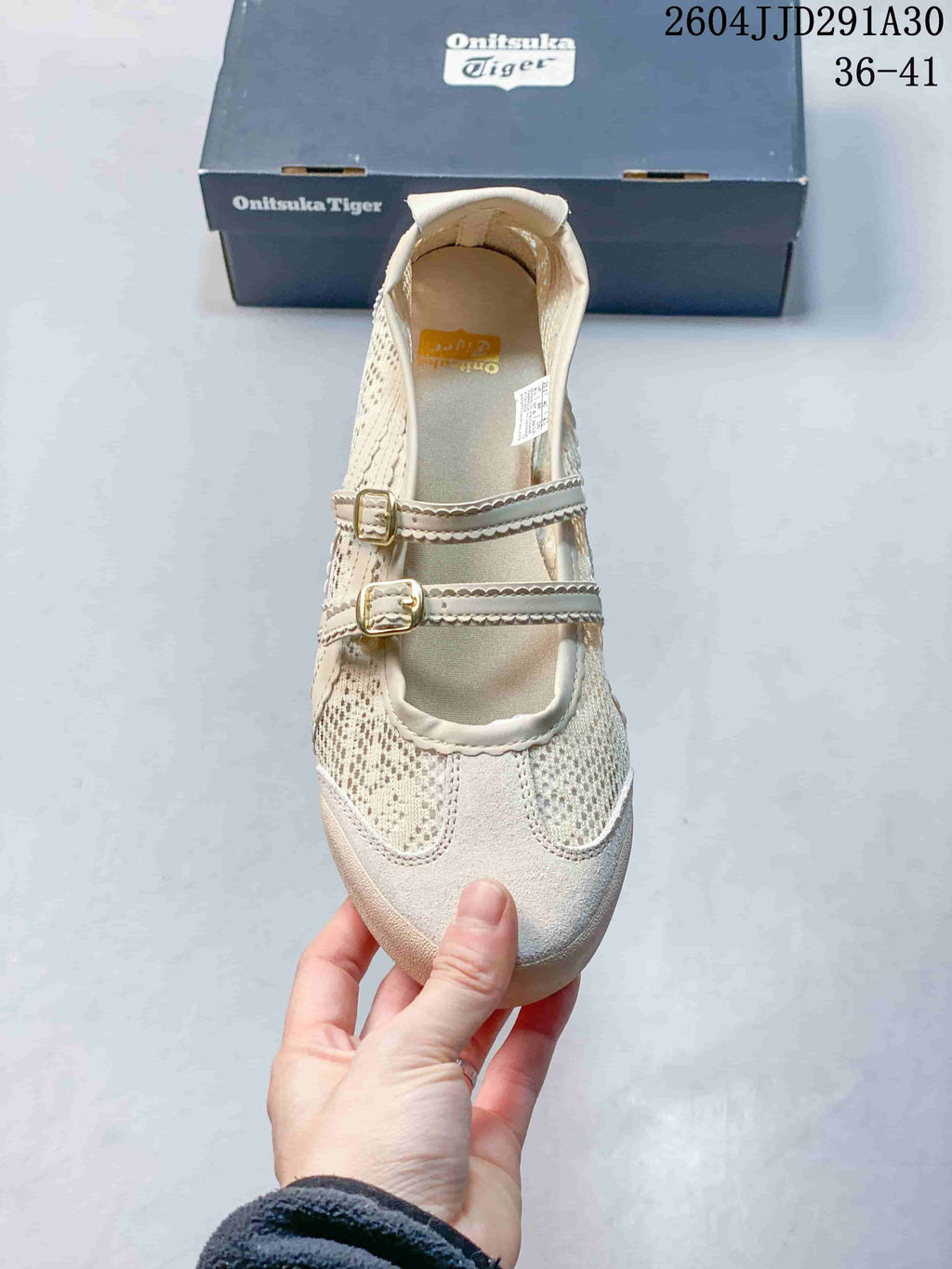 Top view showing the rounded toe, perforated panels, and two metal buckle straps.